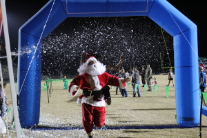 Green Wave Jingle Jam 5k logo